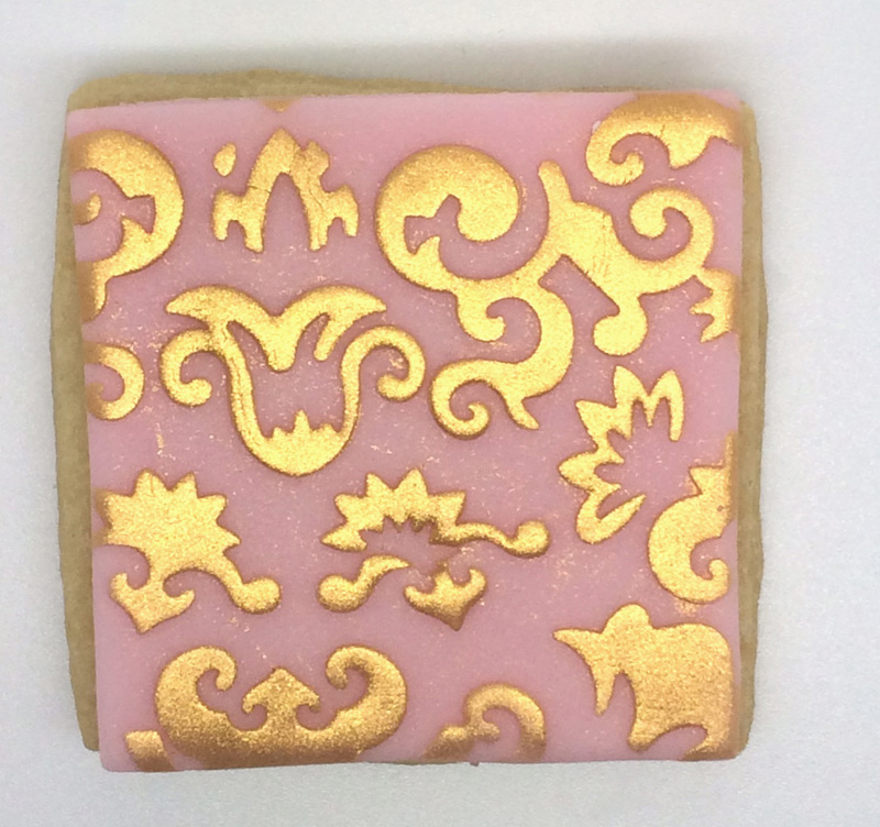 glitzerkeks quadrat rosa mit goldenen Ornamenten