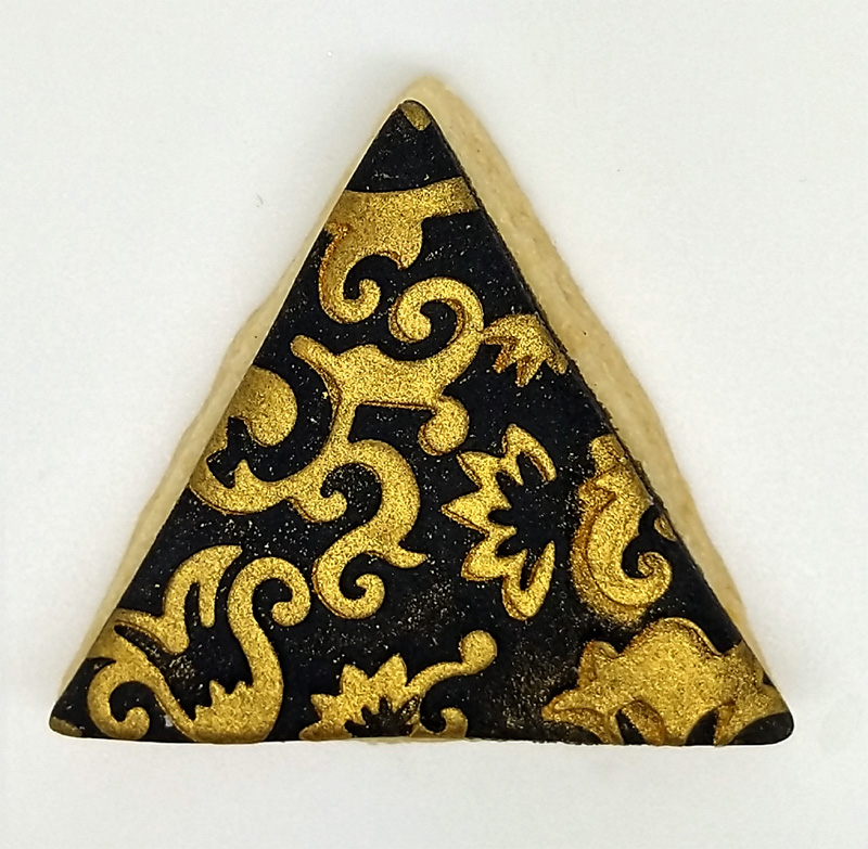 glitzerkeks dreieck schwarz mit goldenen Ornamenten